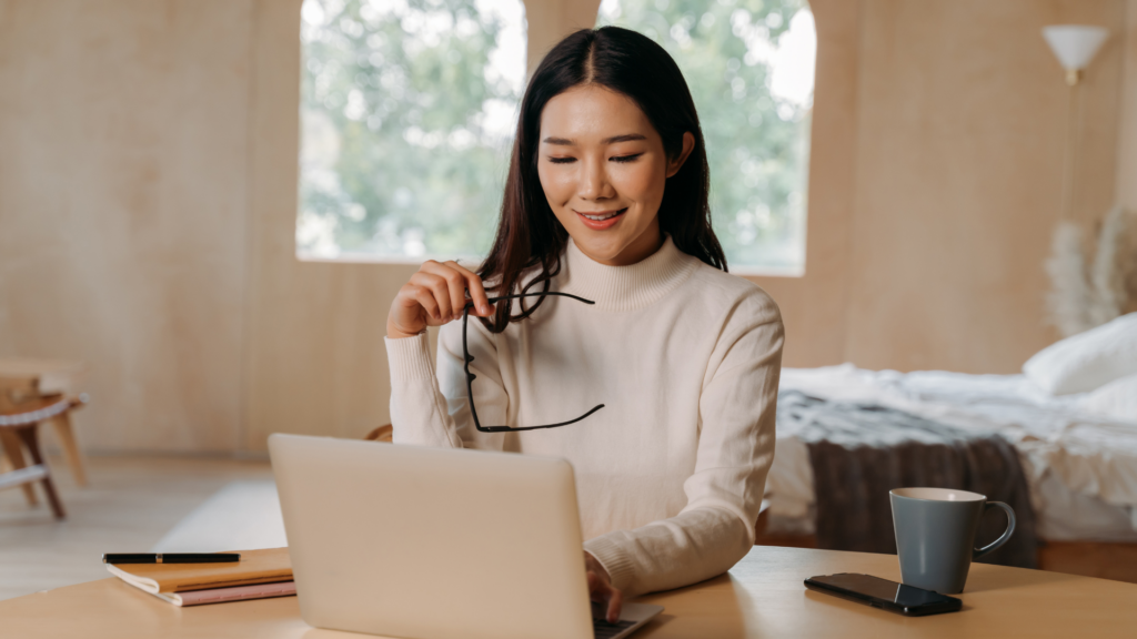A person reading client reviews on a laptop.