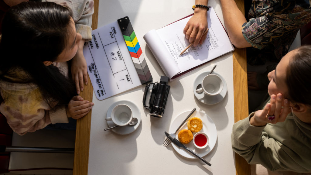  A host and client reviewing a detailed contract for a photoshoot location, ensuring all terms and conditions are clear.