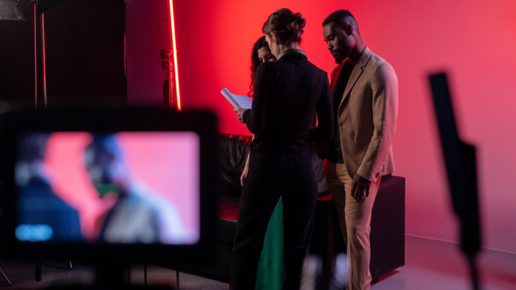 A location manager discussing shoot details with a film crew.