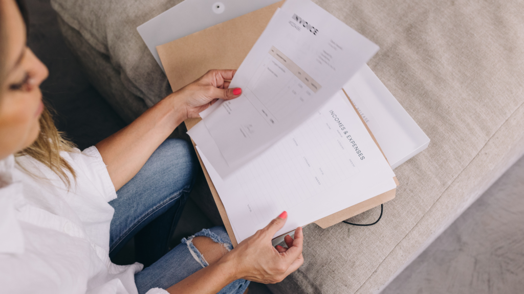 A host reviewing financial documents and planning for high-demand seasons.