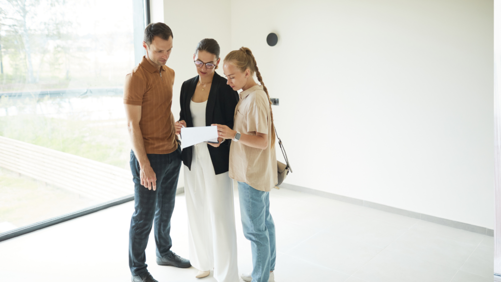 A host discussing details with clients to ensure their satisfaction.