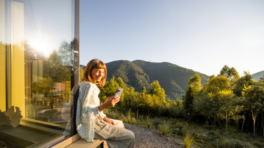 A a woman editing a photo with adjustments being made to a location photo.